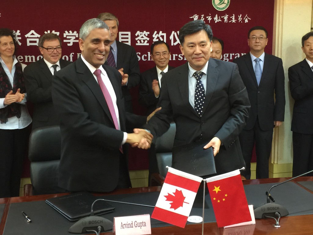 Signing a Memorandum of Understanding with the Chongqing Government for $1.1 million in awards for student exchange